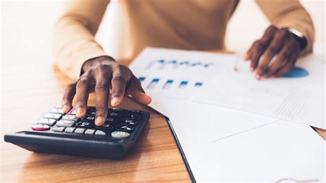 African American Accountant Calculating Budget Of The Company Stock