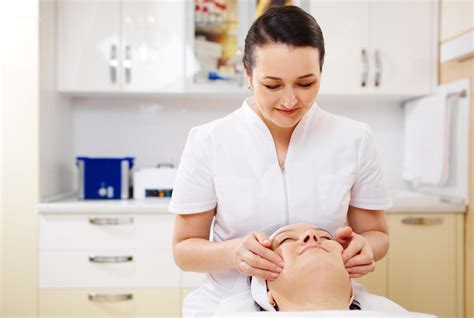Professional Beautician Giving A Facial Massage 2022429 Stock Photo At