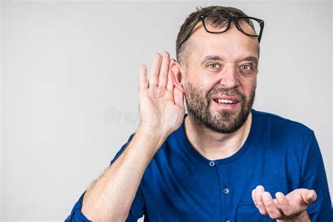 Man Eavesdropping With Hand Close To Ear Stock Photo Image Of Curious