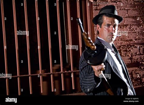 Gangster Holding Tommy Gun On Lookout Stock Photo Alamy