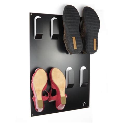 Wall hooks in a mudroom. Unique Wall Mounted Metal Shoe Rack - Black
