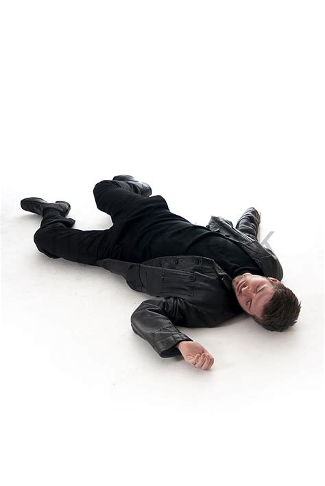 Figurestock A Figurestock Image Of A Man Laying Dead On The Floor