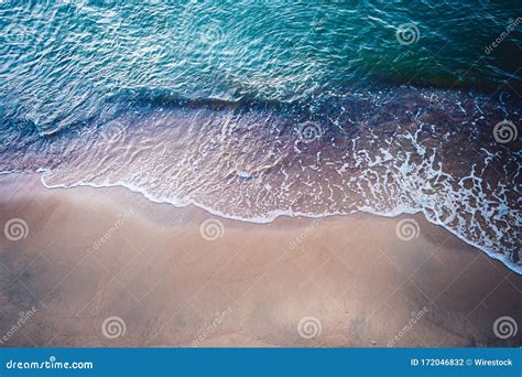 High Angle Shot Of The Sandy Shore Of The Sea With Turquoise Water