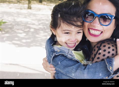 Mother And Daughter Embracing Outdoors Portrait Stock Photo Alamy