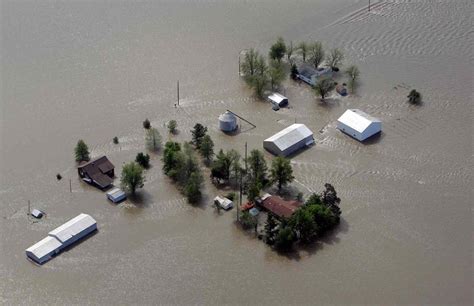 Along Mississippi River Rebuilding Levee After Springs Flood The