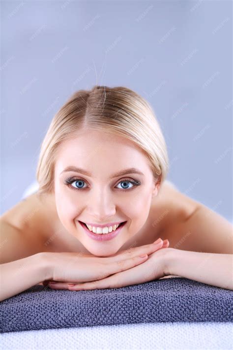 Premium Photo Young Woman Lying On A Massage Tablerelaxing With Eyes Closed