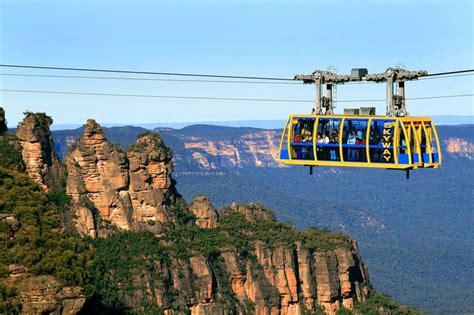 The Cable Car With The 3 Sisters Rock Formation In The Backround At