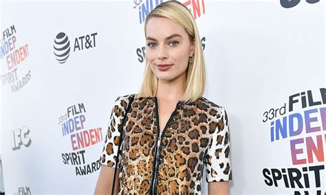 Margot Robbie Stands Out In Leopard Print Dress Daily Mail Online