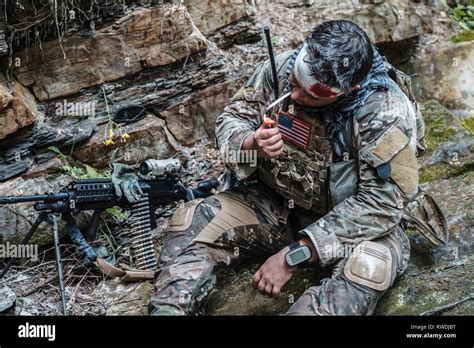 Wounded Army Ranger Machine Gunner In The Mountains Stock Photo Alamy