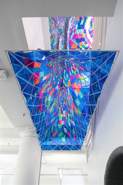 Stain glass art installation that hangs through two floors of Behance's ...