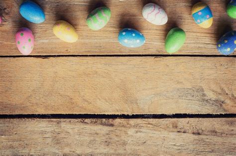Premium Photo Colorful Easter Egg On Wood Background With Space