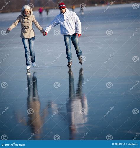 Couple Ice Skating Outdoors On A Pond Stock Photo Image Of Focus