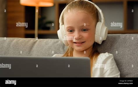 Beautiful Kid Child Little Gamer Studying Online On Laptop At Home
