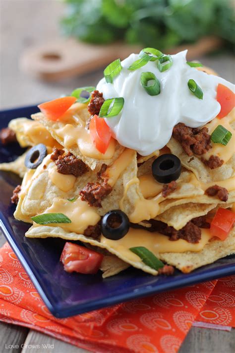 I am a nacho connoisseur and i take offense when people confuse nacho cheese with cheese sauce or simple melted cheese. Chili Cheese Nachos - Love Grows Wild
