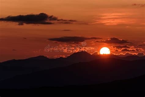 Mountains Sun Sunrise Clouds Sky Stock Photo Image Of Disc Orange