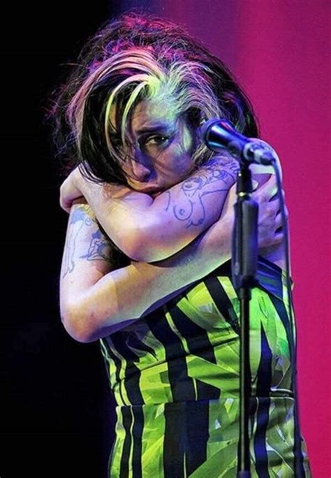 Submitted 11 days ago by cardsandmore. Last image of Amy Winehouse's final performance. : lastimages