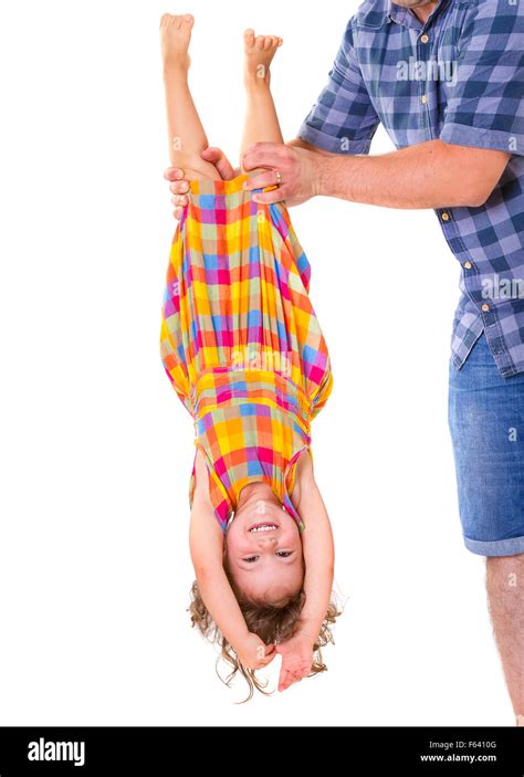 Father Holding His Little Daughter Upside Down Trust Concept Stock
