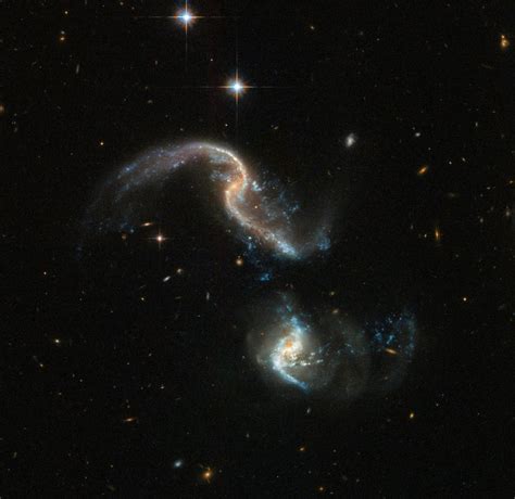 Two Merging Galaxies Caught In New Snapshot By Hubble Space Telescope