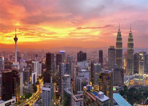 What time zone does kuala lumpur and all of malaysia share? Panoramic views of the Kuala Lumpur skyline at sunset ...