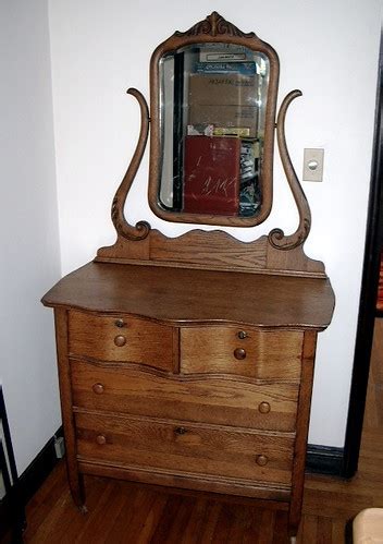 Antique oak dresser with beveled mirror and ornate carving. Early 1900s Antique Oak Dresser with Mirror | $240 This is ...