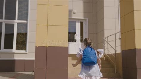 Little Happy Child Girl Runs With School Backpack School Child
