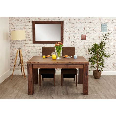 A dining table can finish off a room beautifully creating a focal point and a great hub for gatherings and entertainment. Modern Dark Wood Solid Walnut Extending Dining Table 6 to ...
