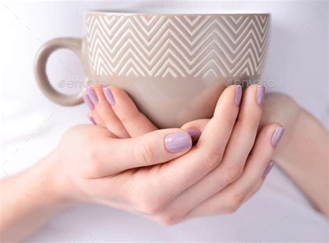 Hands Of A Young Woman Holding A Cup Of Tea Stock Photo By Nataljusja