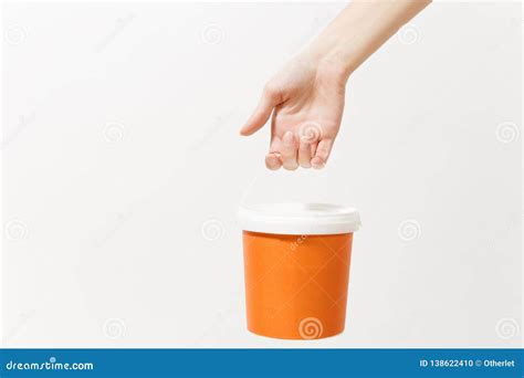 Close Up Of Female Hand Vertical Holds Empty Paint Bucket With Copy