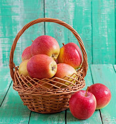 Ripe Red Apples In A Basket On Wooden Background 1314801 Stock Photo At