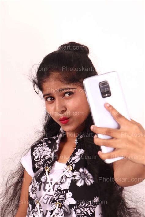 an indian girl taking selfi stock image photoskart