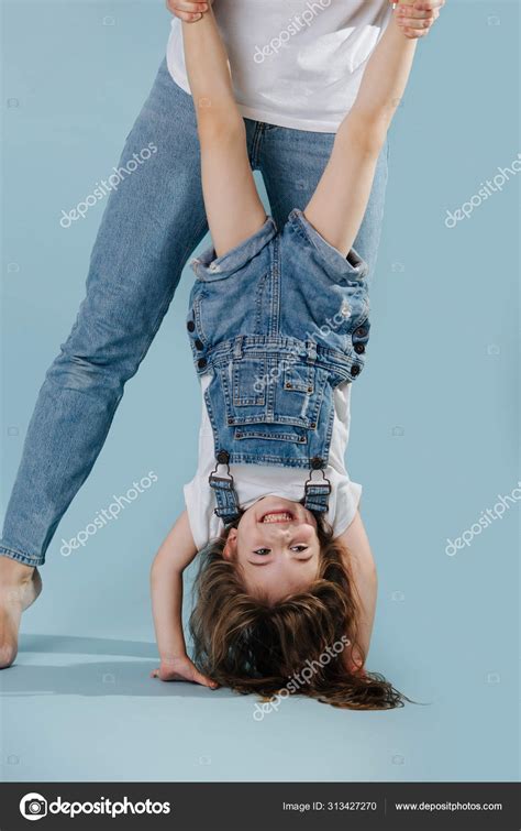 Happy Mom And Daughter Play Active Games Stock Photo By ©zzzdim 313427270