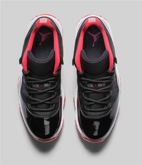 A red translucent outsole, white midsole, and 23 insignia on the heel completes. Air Jordan 11 (XI) Retro Low - Black / True Red-White ...