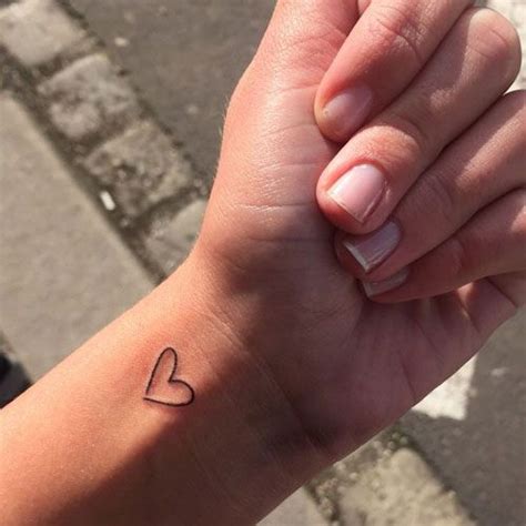 Amazing Outline Small Heart Tattoos On Wrist Download