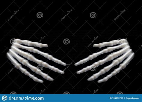 Skeletal Hands On Black Background With Copy Space Death And Mistery