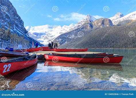 Red Canoes At Lake Louise With Rocky Mountain In Banff National Park