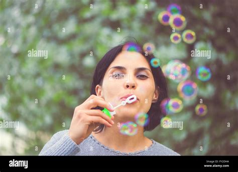 Beautiful Woman Blowing Bubbles Stock Photo Alamy