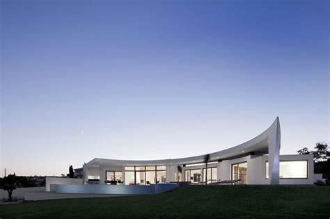 Arc House With Luxury Interiors And Edgy Curved Roof