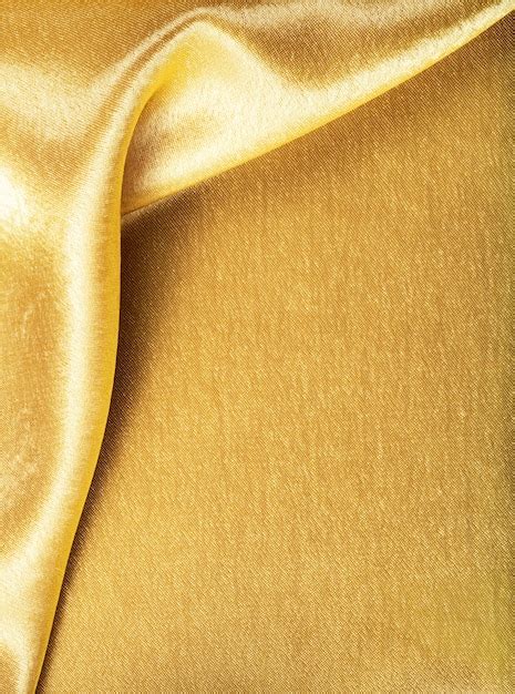 Premium Photo Golden Fabric Silk Texture