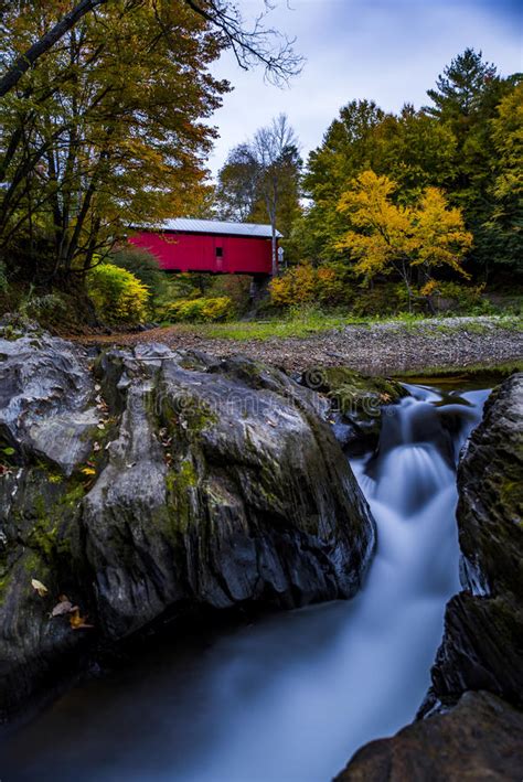 Red Covered Bridge And Waterfall Autumn Fall Vermont Stock Photo