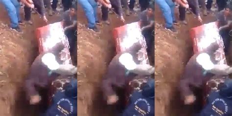 woman s dead body falls out of her coffin during her funeral after pallbearer tumbled and fell