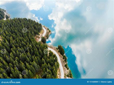 Aerial View Over Beautiful Turquoise Mountain Lake And Green Forest