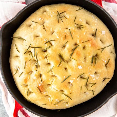 Skillet Focaccia Bread With Rosemary Cooking On The Front Burner