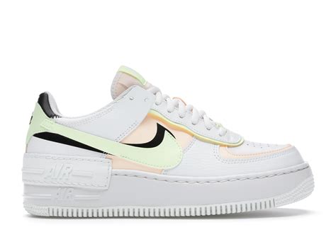The nike swooshes are sitting on top of each other, while the exaggarated stacked midsole features an 'air' tab to the side. nike air force 1 shadow W88386