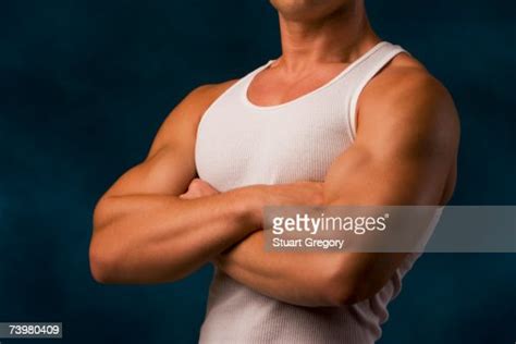 Muscular Man Flexing Biceps And Forearm Muscles High Res Stock Photo