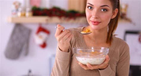 smiling attractive woman having breakfast in kitchen interior stock image image of breakfast