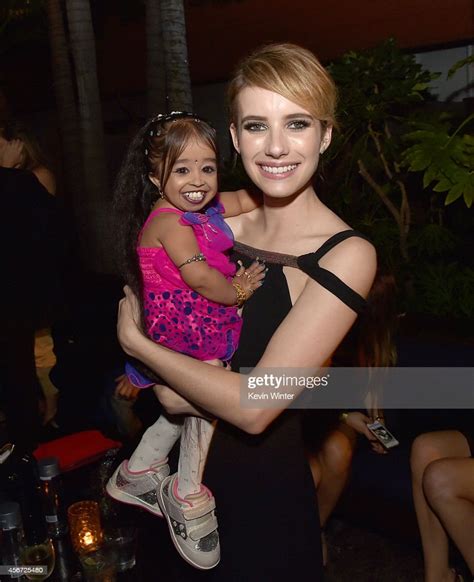 Actresses Jyoti Amge And Emma Roberts Pose At The After Party For The