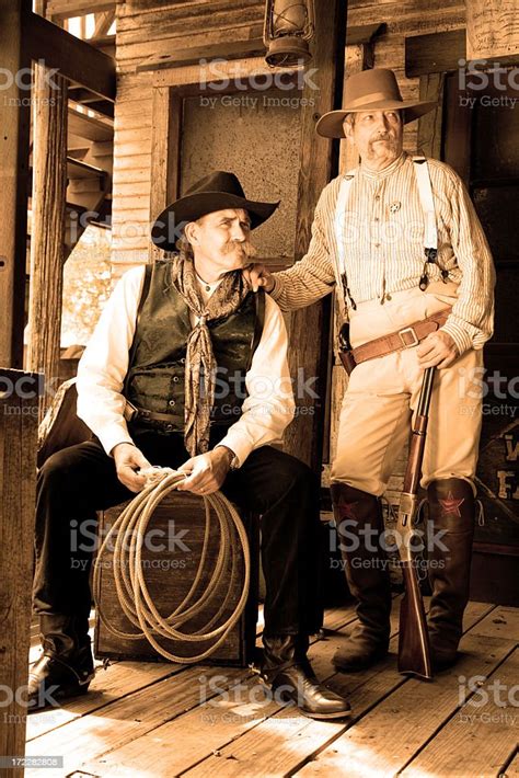 Old Cowboys In Sepia Antique Vintage Wild West Town Stock Photo
