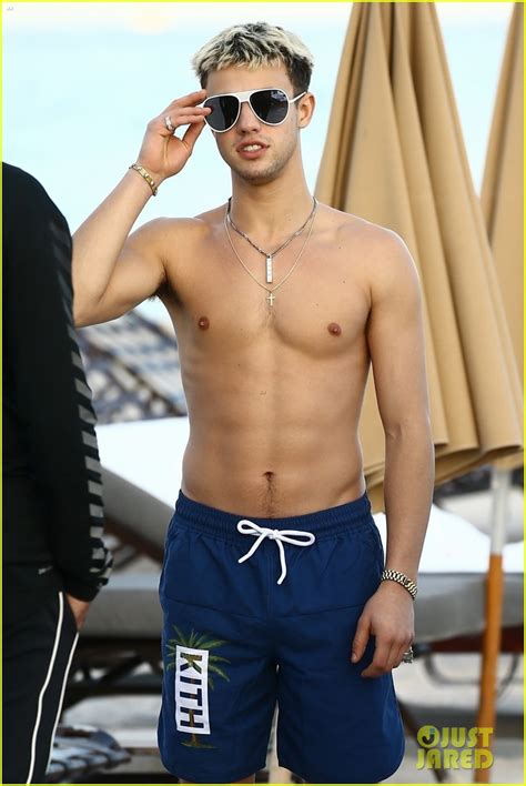 cameron dallas goes shirtless for new year s eve beach day photo