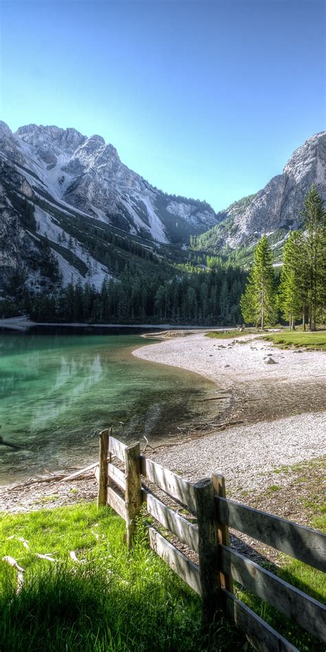 1080x2160 Conifer Fence Lake Landscape Outdoors Nature Photography 5k