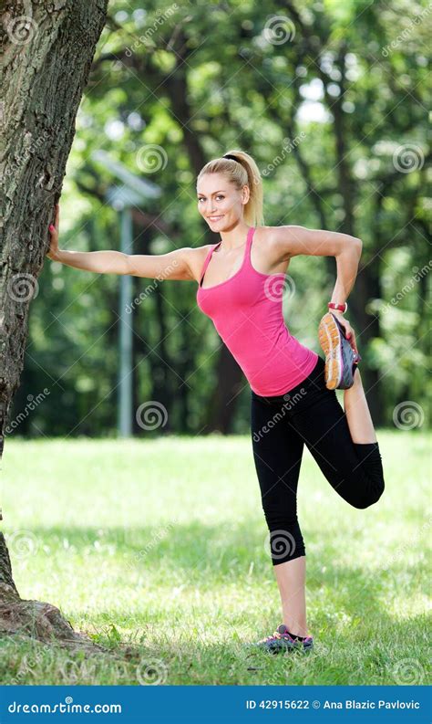 Stretching Outdoors In The Sun Royalty Free Stock Photography